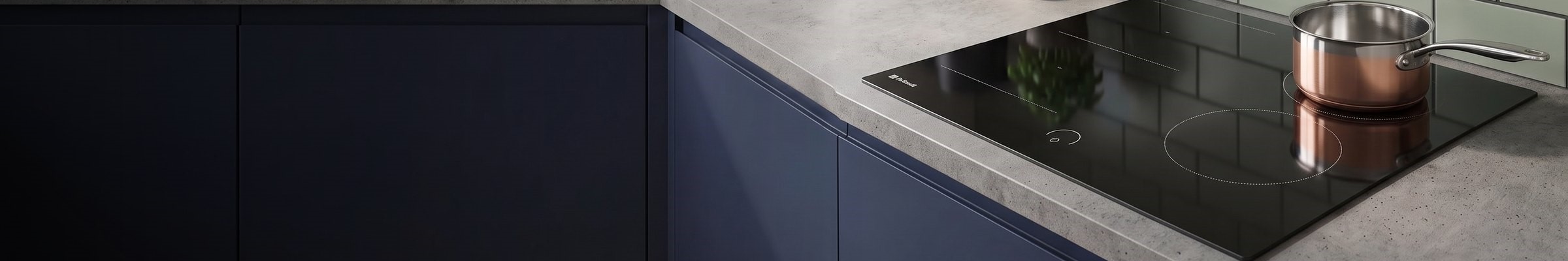 DeSantii 60cm black induction hob with a flex zone set into a grey worktop with green tiles