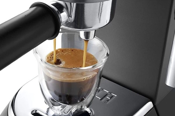 DeLonghi Dedica pouring espresso
